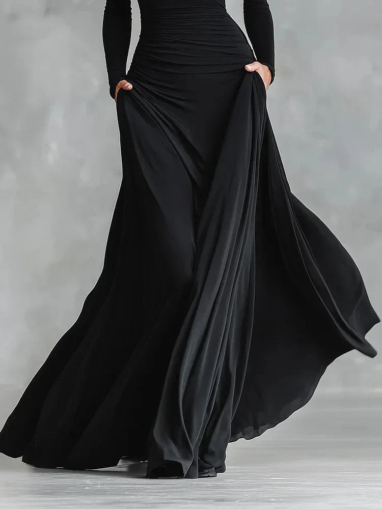 Modern long black crepe dress with pleated boat neckline
